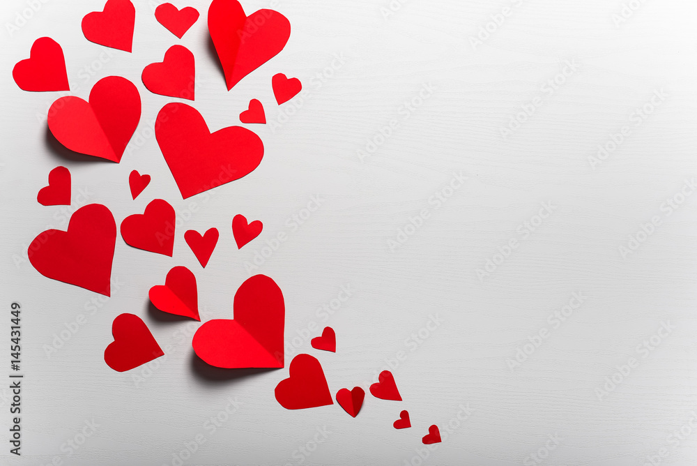 Wooden white background with red hearts. The concept of Valentin Wooden white background with red hearts. The concept of Valentin
