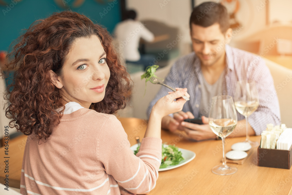 Nice looking couple in cafe