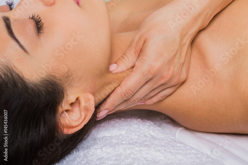 Beautician doctor make neck massage in spa wellness center