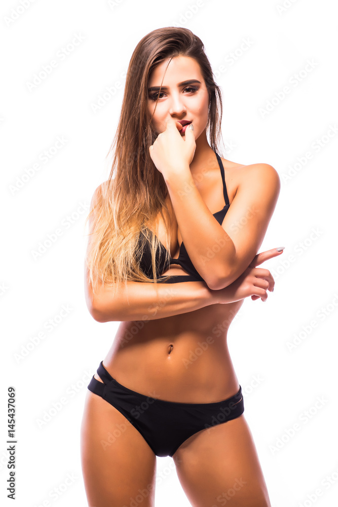 Sexy woman wearing navy black swimwear posing on white background. Sexy woman wearing navy black swimwear posing on white background.