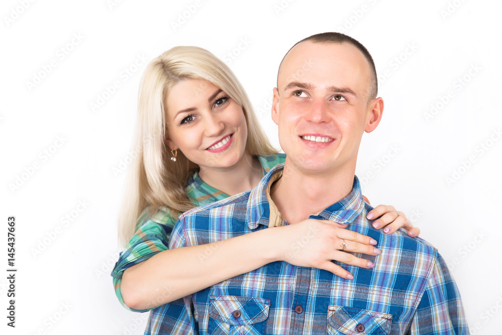 Studio portrait of a happy smiling couple. Studio portrait of a happy smiling couple.