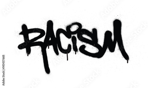 graffiti racism word sprayed in black over white