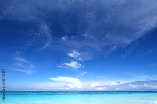 Beautiful tropical seascape with clear blue sky and soft white clouds. Tachai island  Andaman sea  Thailand