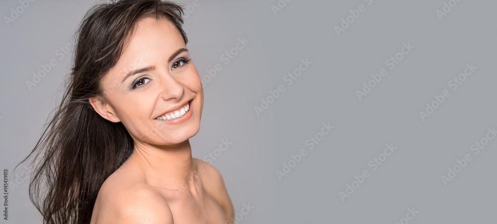 Portrait of a young, beautiful and smiling young woman. Portrait of a young, beautiful and smiling young woman.