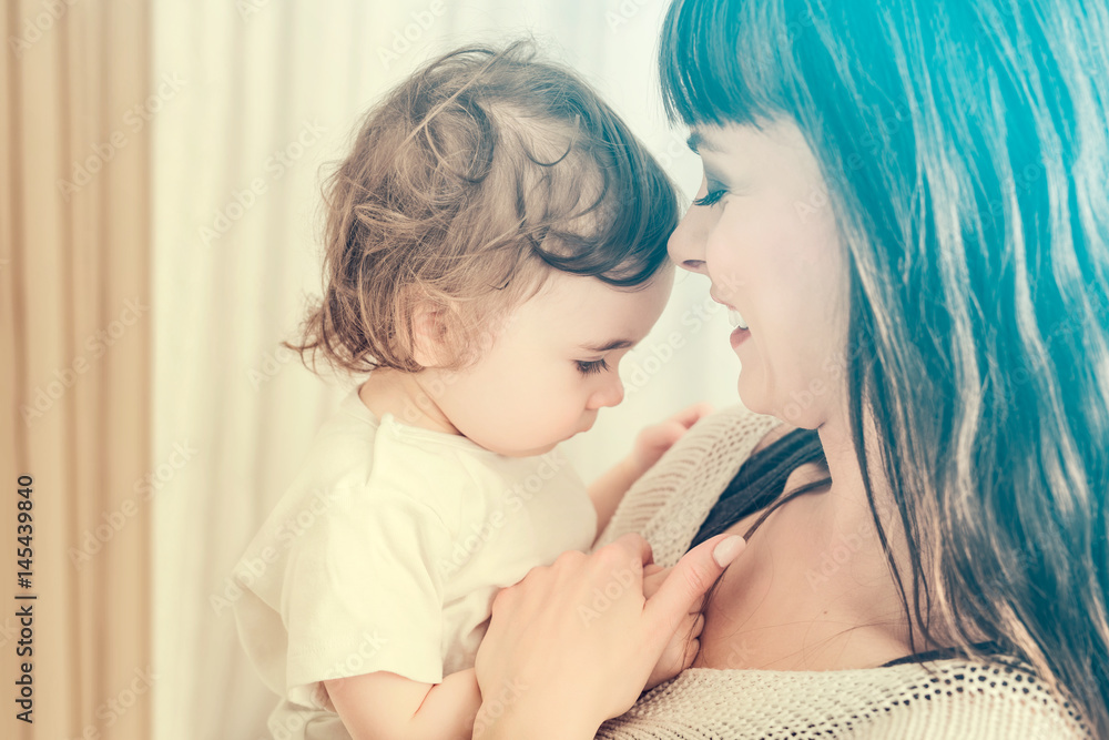 Smiling mother with baby girl. Daughter close to loving mom. Smiling mother with baby girl. Daughter close to loving mom.