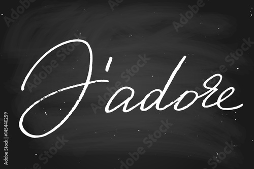J'adore. I adore in French. Handwritten text, chalk on a blackboard, vector. Each word is on the separate layer