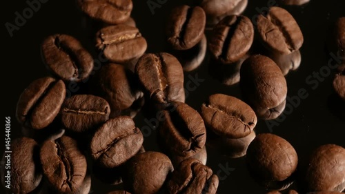 Coffee grains macro rotate with specular reflection