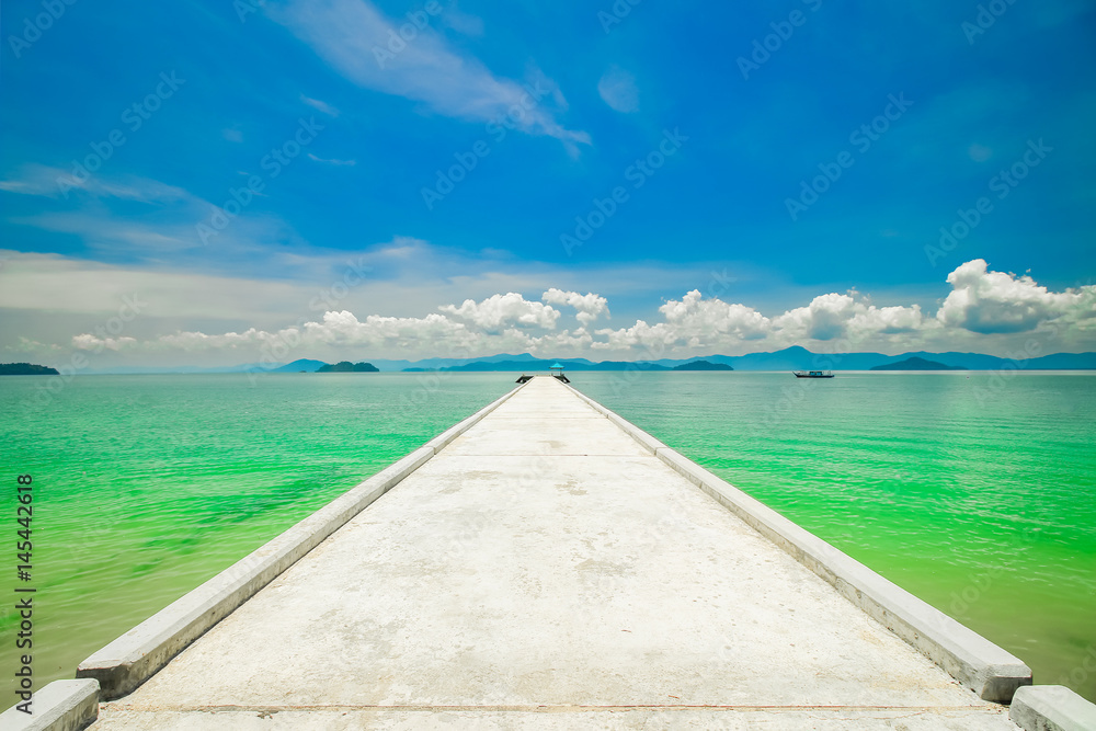 Fototapeta premium Cement way for walking to the beautiful beach