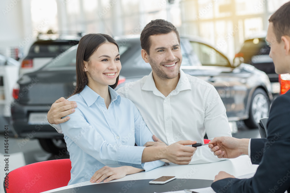 Young People in a Car Rental Service Transportation Concept Young People in a Car Rental Service Transportation Concept