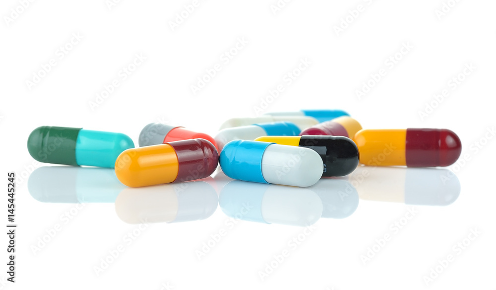  medical capsules on white background.