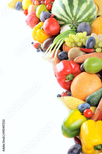 Fototapeta Naklejka Na Ścianę i Meble -  Ripe and tasty fruits and vegetables on a white background