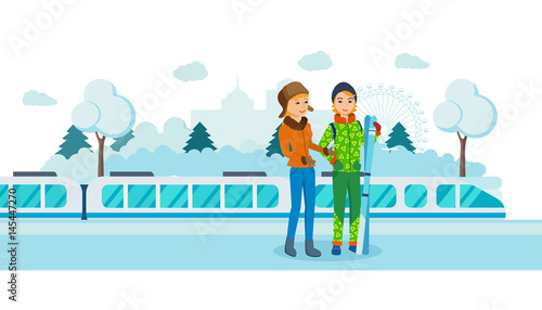 Two friends with skis at the railway winter station.