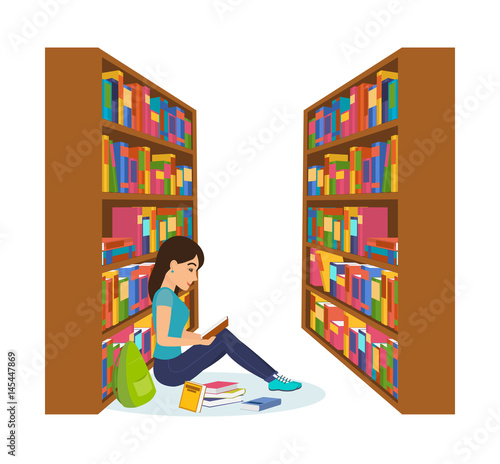 Girl in library, reading book and working with necessary materials.