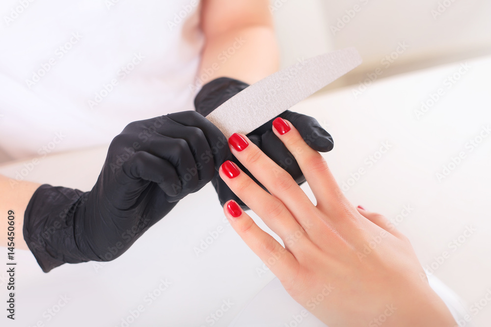 Hands in gloves cares about hands nails. Manicure beauty salon. Hands in gloves cares about hands nails. Manicure beauty salon.