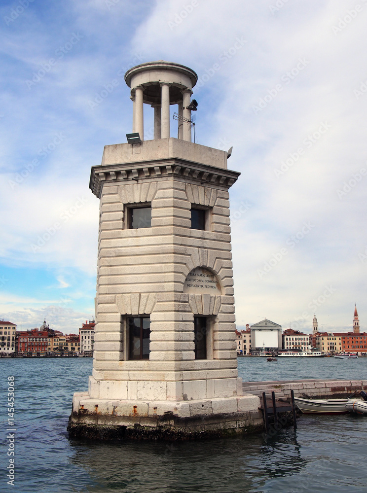 lighthouse in san giorgio venice with panoramic view of venetian coastline clouds and sea
