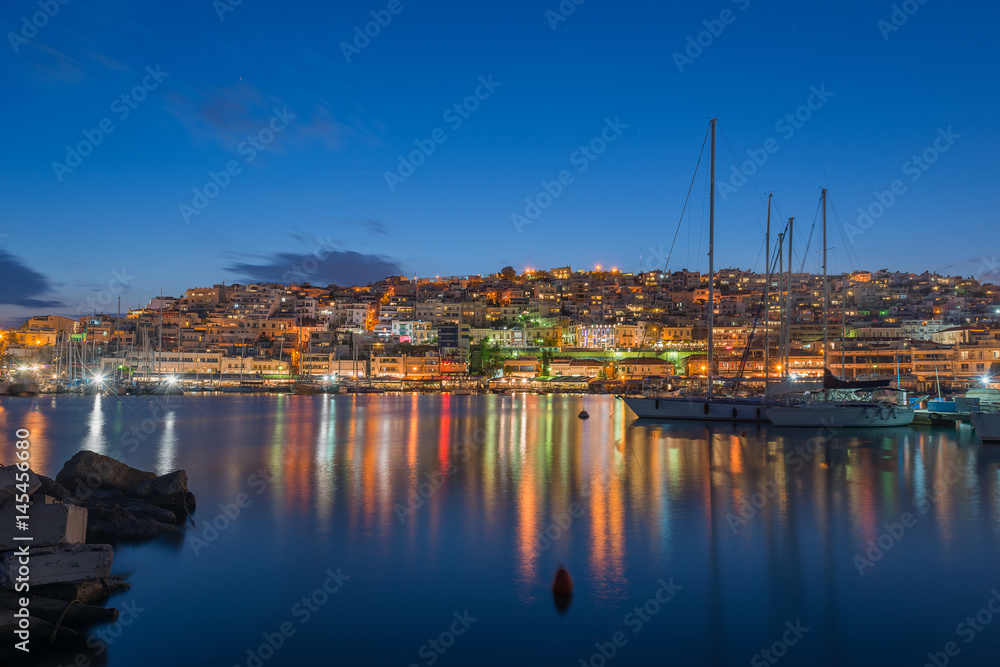 Mikrolimano and view of Kastella hill in Greece during blue hour Mikrolimano and view of Kastella hill in Greece during blue hour