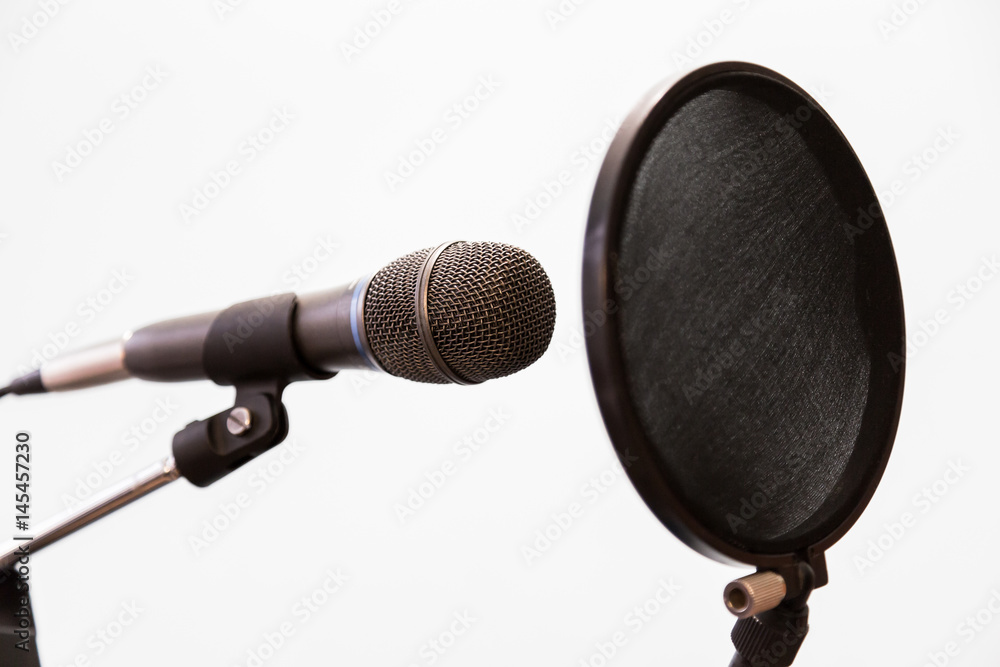 Fotografie Cardioid condenser microphone and pop filter on a gray background