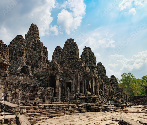 Prasat Bayon with smiling stone faces is the central temple of Angkor Thom Complex, Siem Reap, Cambodia. Ancient Khmer temple with frescoes and columns, World Heritage. 