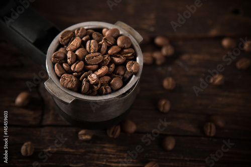 Fresh coffee beans in coffe...