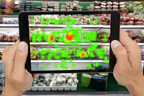 internet of things marketing concepts,man holding tablet to know the data of eye contract of customer by augmented reality technology,to collect and analysis data that customer like and wish to buy