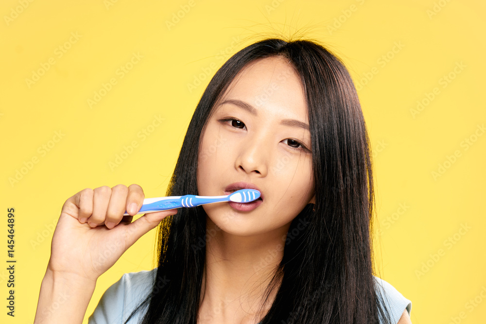 beautiful brunette asian appearance, toothbrush