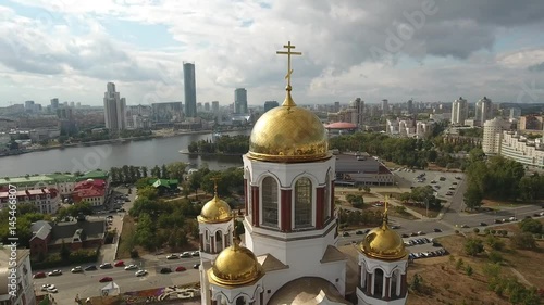 Unique aerial flight close center. Old Church of All Saints Yekaterinburg Russian Orthodox Nicholas II. Golden domes cross. Important historic best attraction. Blue clouds day. fifa 2018 photo