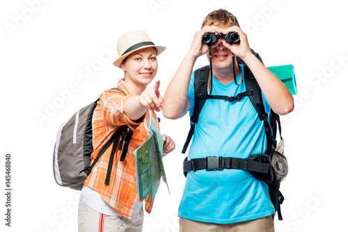 Traveler with binoculars and his girlfriend with a map on a white background