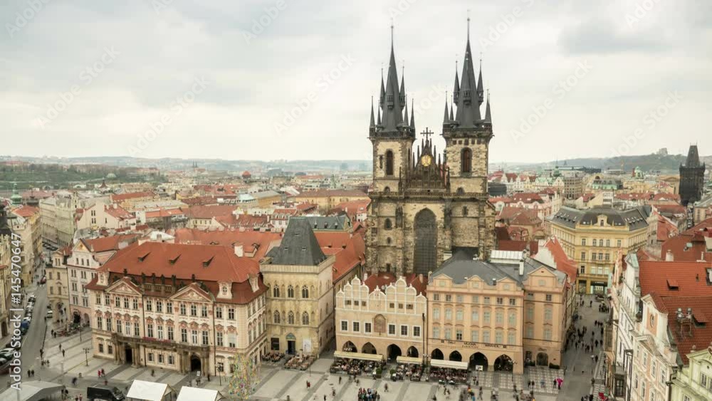 Old Town Hall with its huge towers, historic multistoreyed buildings, covered with red tile, impressive view, rushing back and forth tourists, in the daytime in spring, taken as a timelapse shot Old Town Hall with its huge towers, historic multistoreyed buildings, covered with red tile, impressive view, rushing back and forth tourists, in the daytime in spring, taken as a timelapse shot