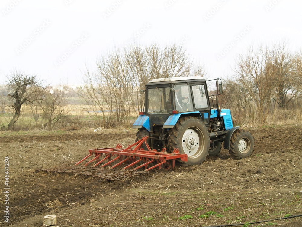 tractor in a field tractor in a field