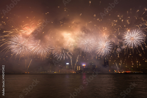 Fireworks show along Victoria harbor in Hong Kong, China. photo