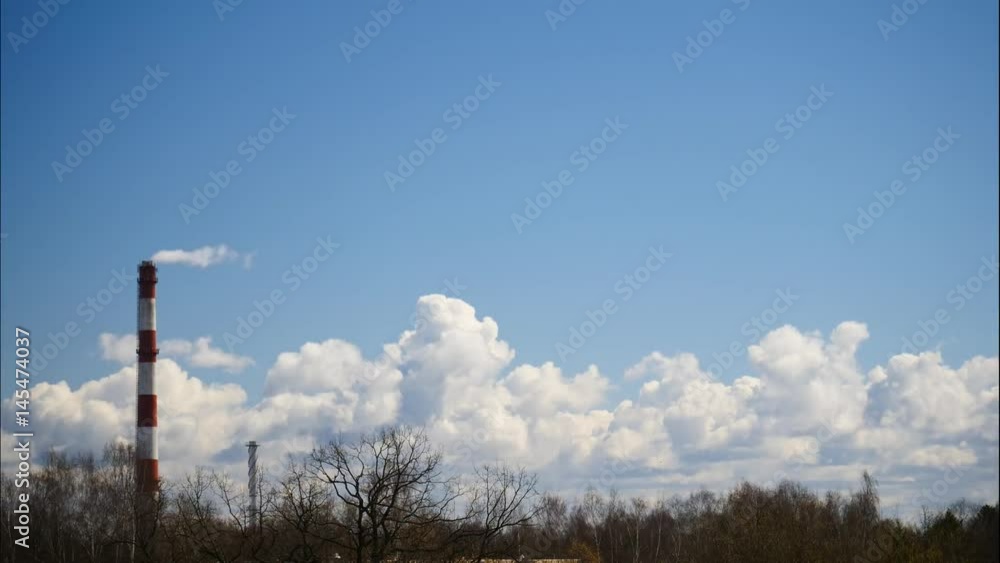Time Lapse Sky and moving clouds Power Plant pipe with smoke Latvia 4K Time Lapse Sky and moving clouds Power Plant pipe with smoke Latvia 4K