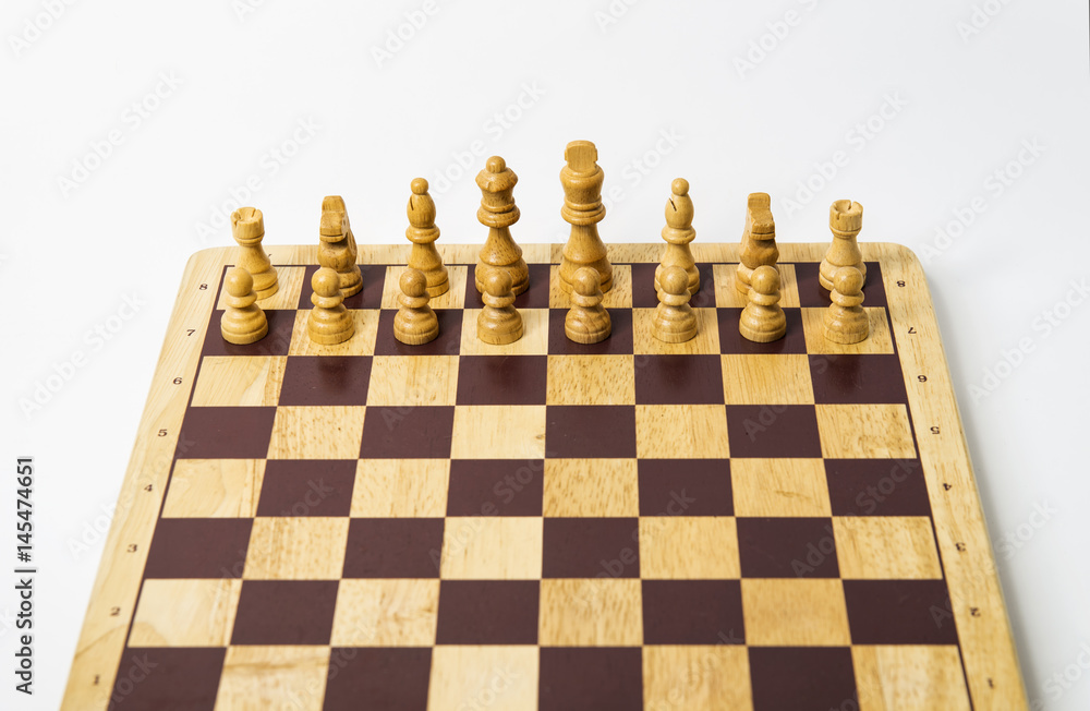 White pieces - chess board on white background in studio White pieces - chess board on white background in studio