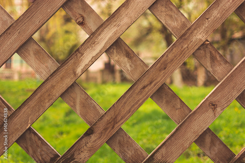 Background. Wooden fence. Across.