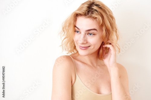 Portrait of a girl blonde on white background