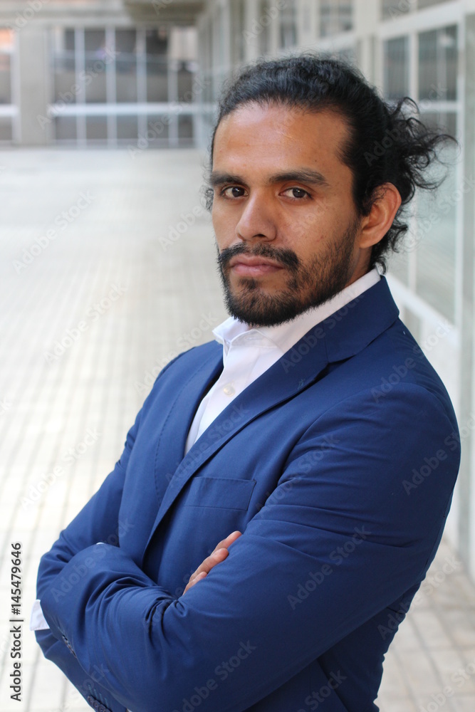Ethnic business confident man posing with folded arms - Stock image Ethnic business confident man posing with folded arms - Stock image