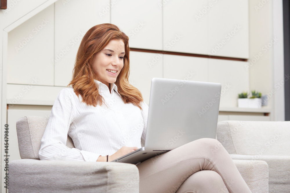 Young woman shopping online and showing credit card Young woman shopping online and showing credit card