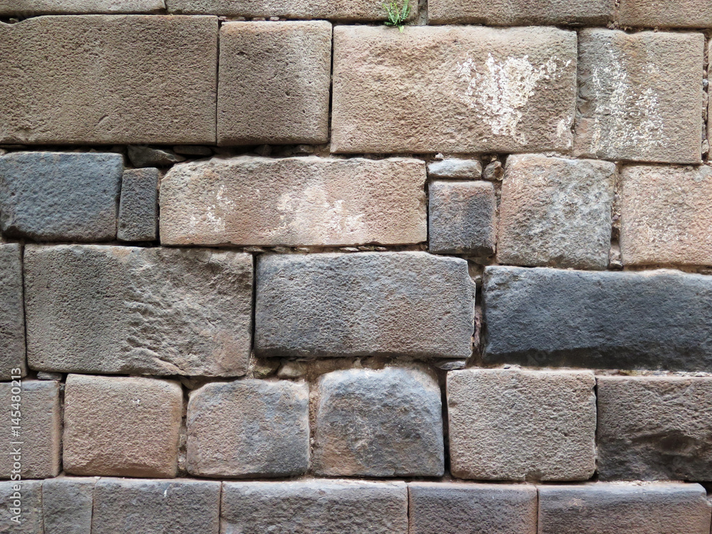 Inca wall made of natural volcanic stones. Cusco Peru Inca wall made of natural volcanic stones. Cusco Peru