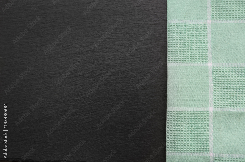 Fototapeta premium Rustic napkin and black slate dish with copy space for your menu or recipe. Menu card for restaurants.