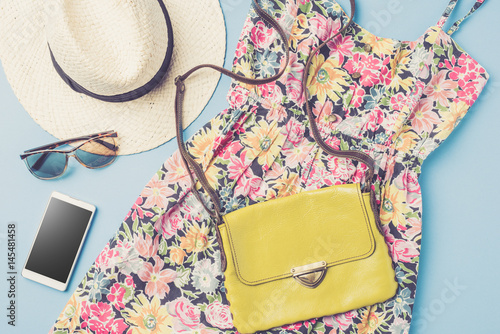 Casual female dress with straw hat, bag and accessories. Summer fashion concept