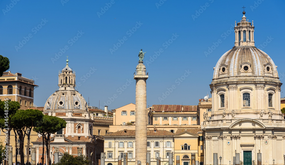 Colonna Traiana (Trajan's Column) and church of Most Holy Name of Mary at the Trajan forum in Rome, italy