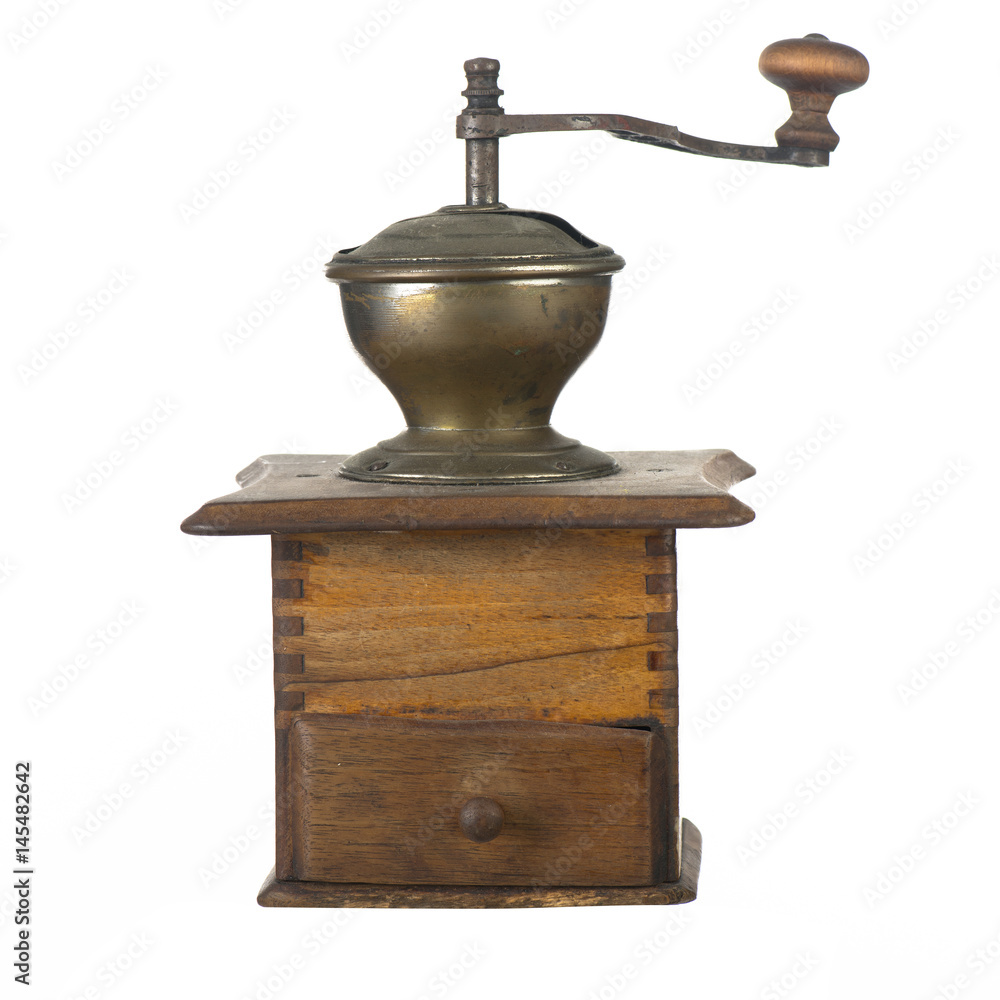 Ancient wooden coffee grinder with a lid and a handle on a white background Ancient wooden coffee grinder with a lid and a handle on a white background