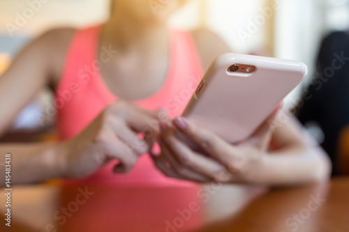 Woman sending sms on cellphone