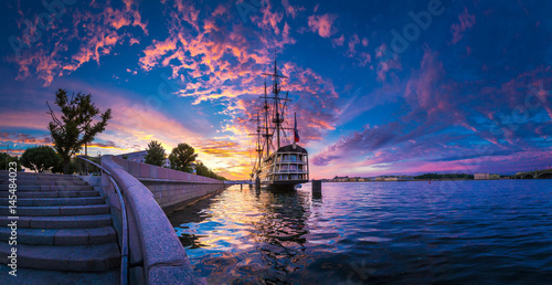 Sailing boat sillhouette at sunset. St. Petersburg. Trinity Bridge.
