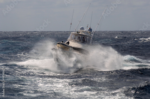 Sports Fishing Boat returns to anchorage in rough seas