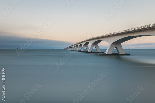 Long exposure photo of Zeeland bridge at sunset, Zierikzee, the Netherlands