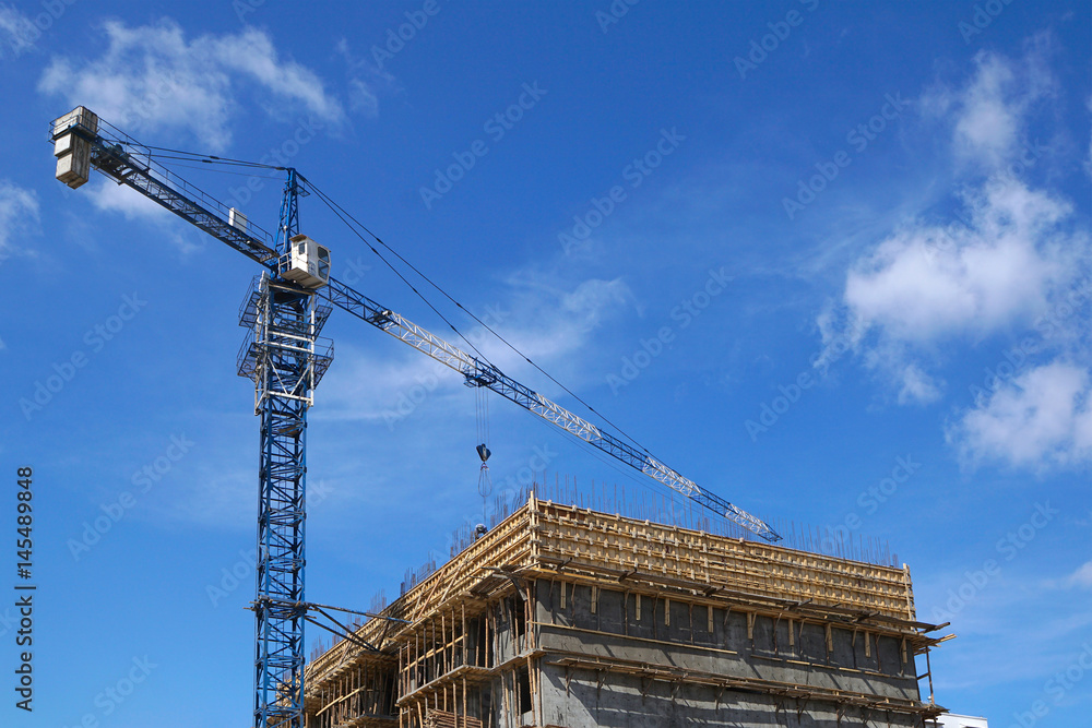 Tower crane building a building