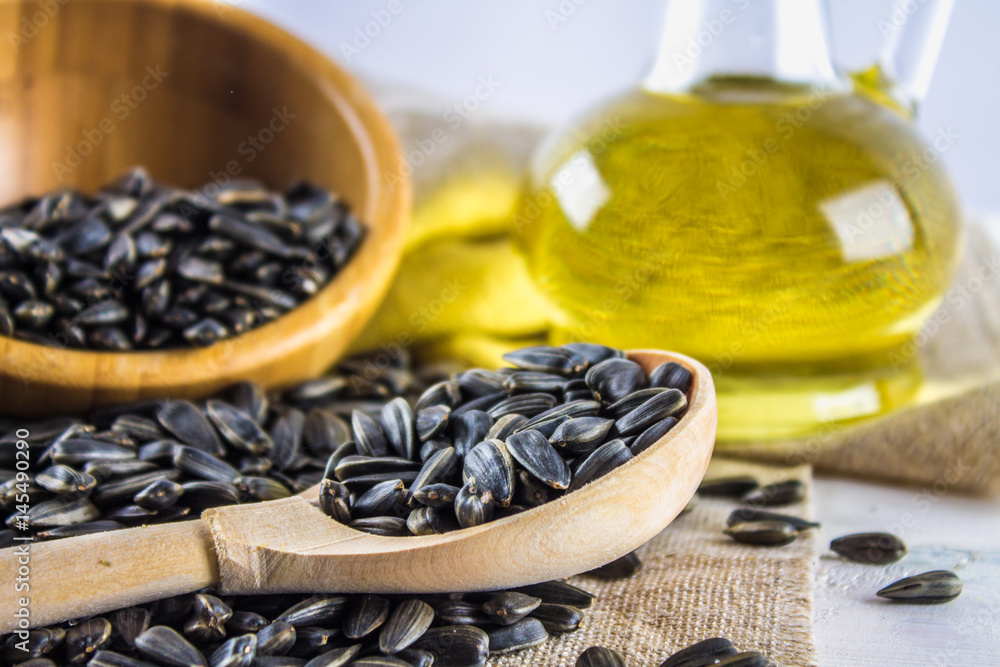 Sunflower seed and oils on wooden table. Sunflower seed and oils on wooden table.