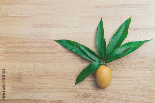 Mango on a wood background