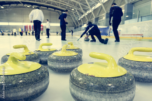 Photo Curling stone on a game sheet.