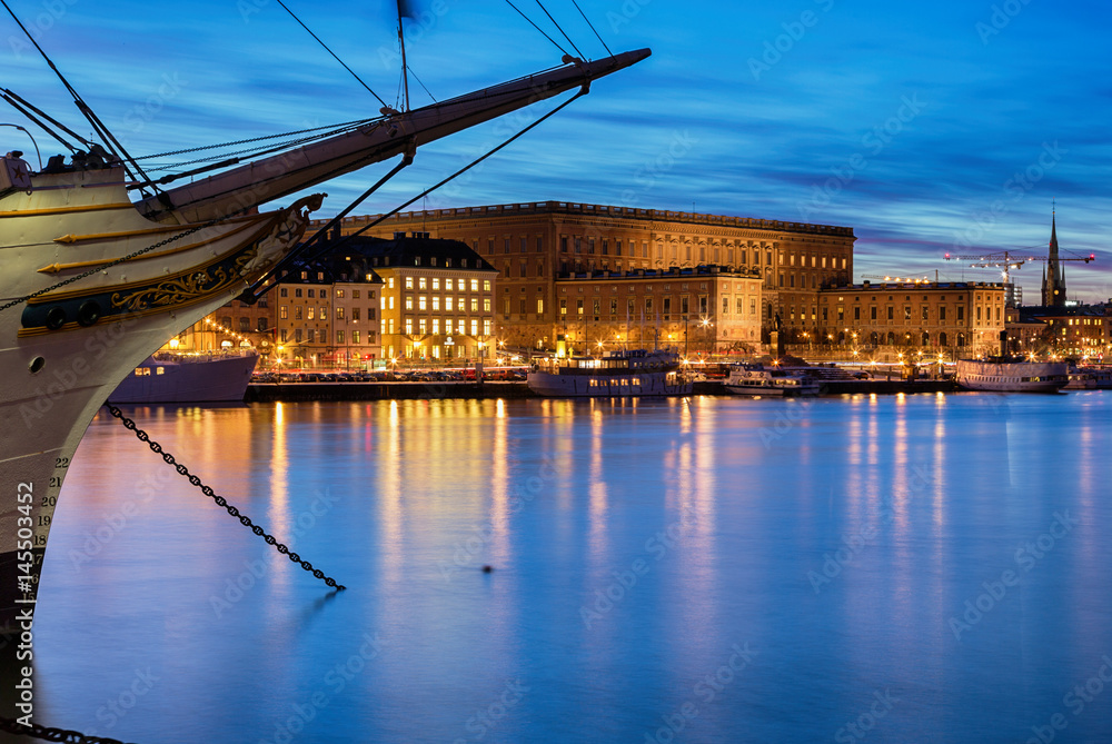 Stockholm night image with vintage ship and Royal Palace.